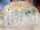 A vessel is inscribed with a poem of Solon